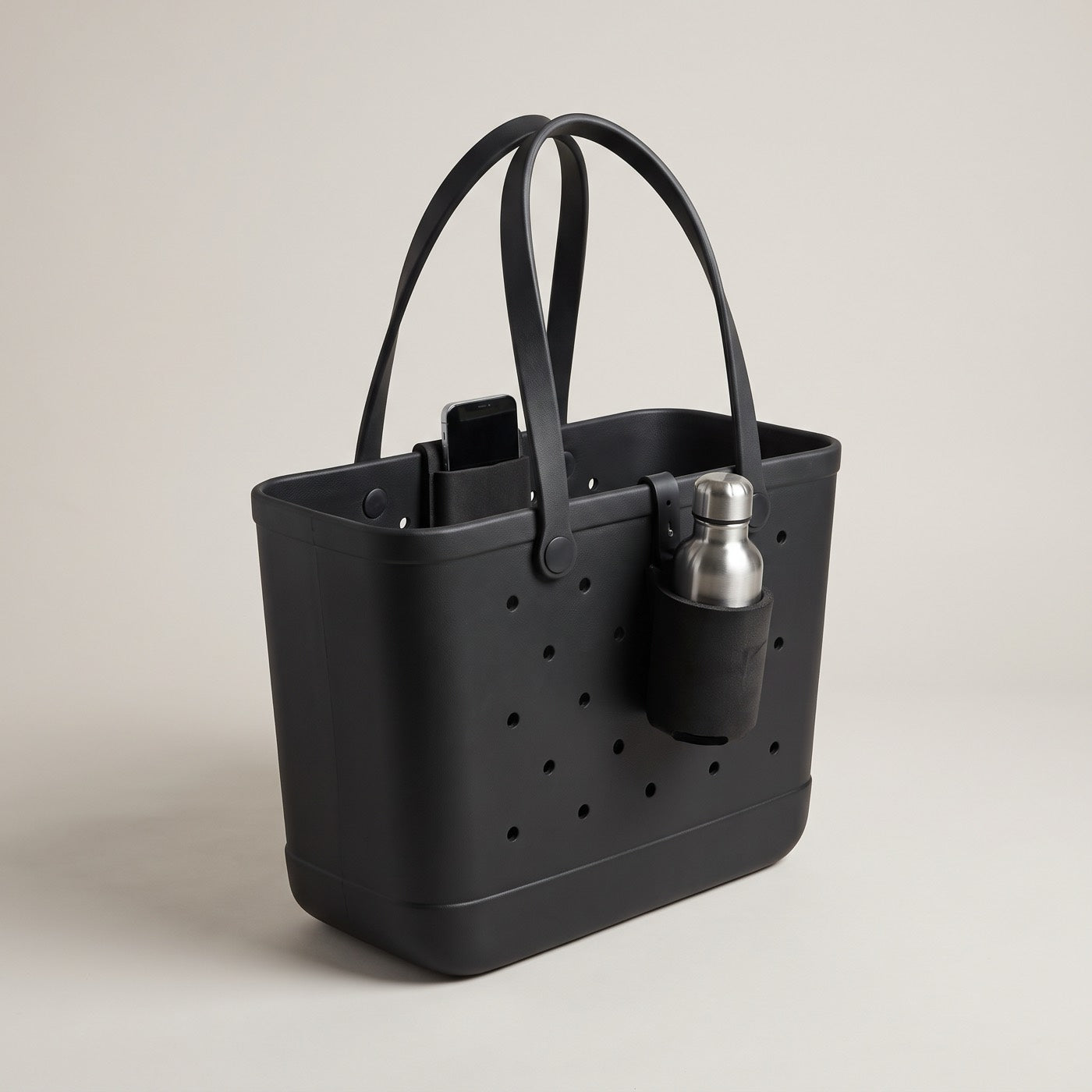 The Full Kit — black EVA tote with clip-in cup holder and phone stand, AI render